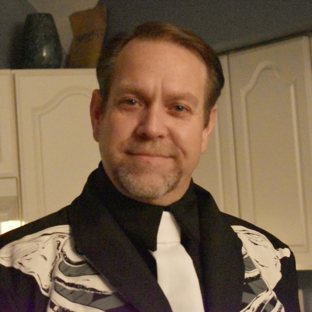 John wearing a skeleton blazer